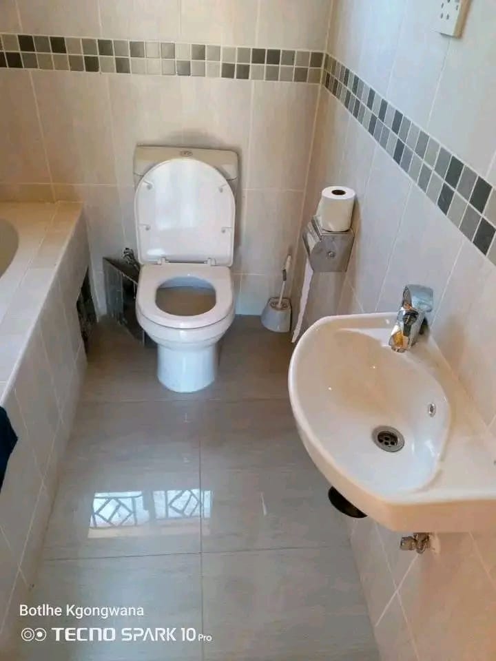 Tiled bathroom with bathtub