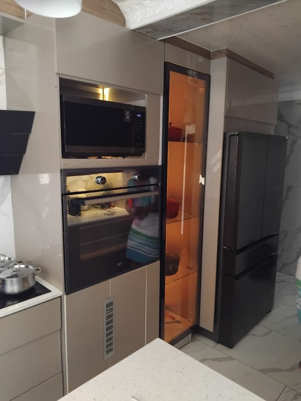 Open-plan kitchen with TV cabinet