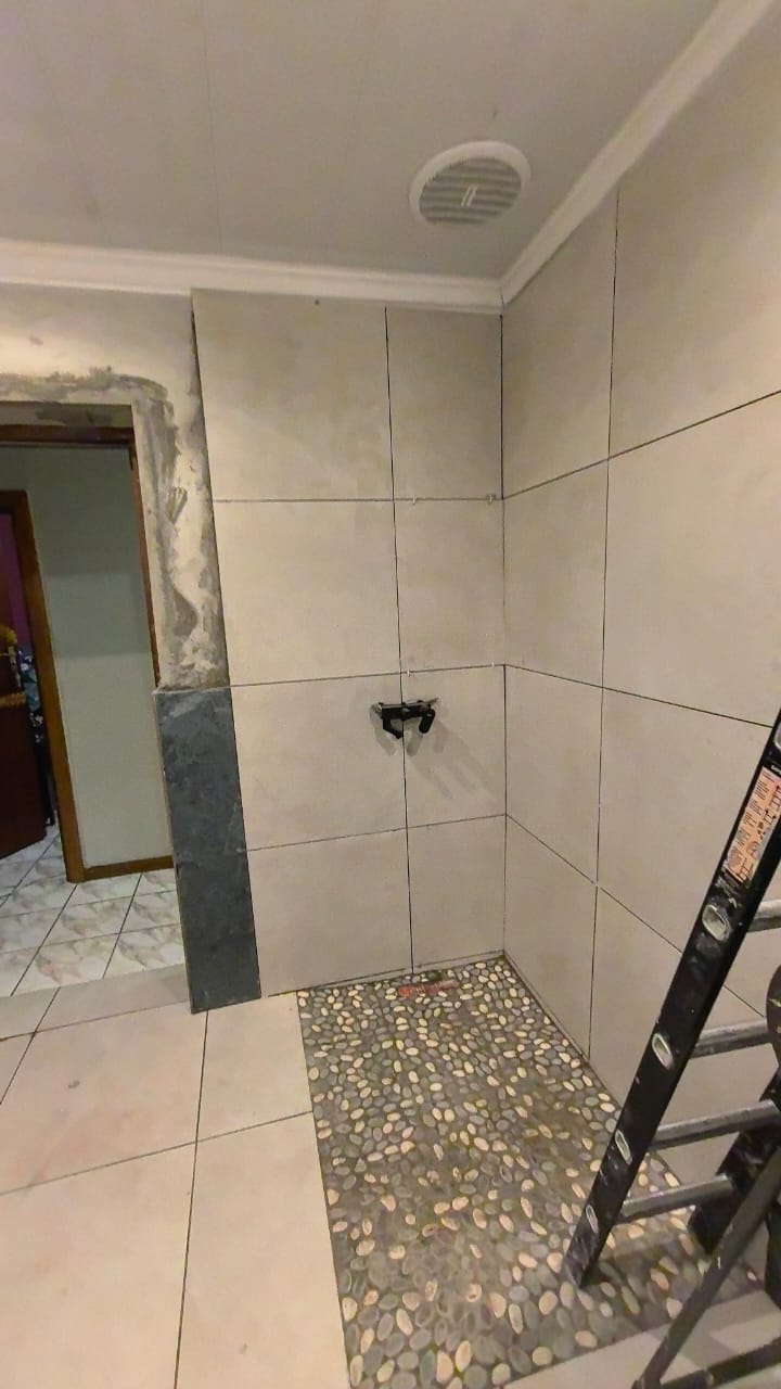 Walk-in pebble shower
