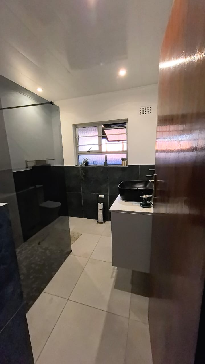 Dark-tile bathroom