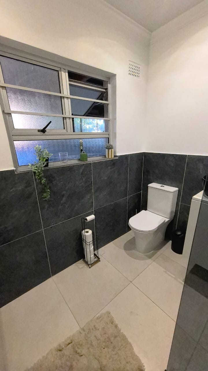 Dark-tile guest bathroom