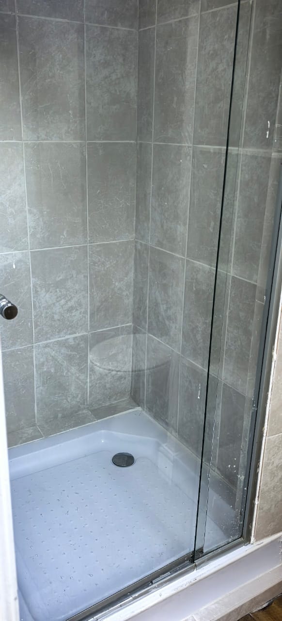 Glass shower with marble base