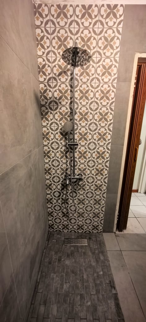 Patterned-tile shower stall